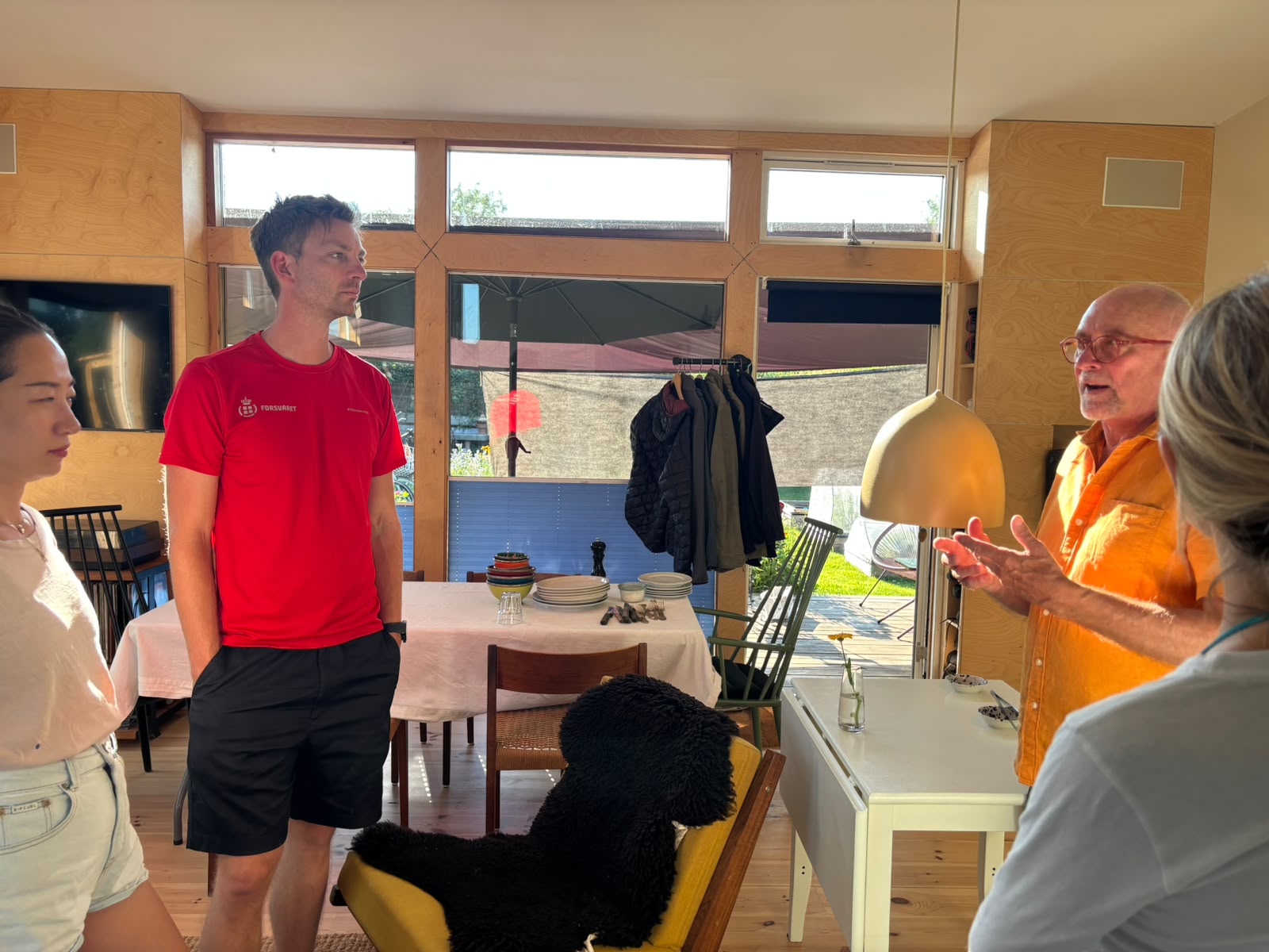 A SILVERS host in conversation with guests in his Copenhagen home